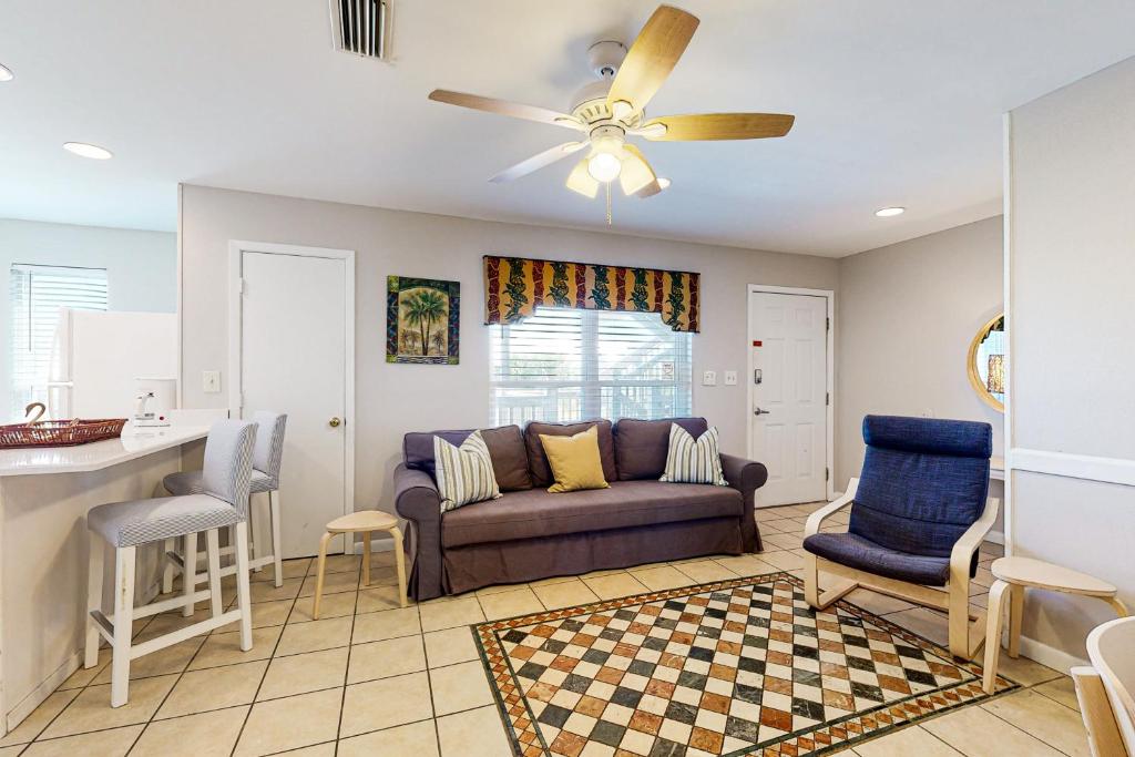 a living room with a couch and a table at Seahorse 612 in Gulf Shores