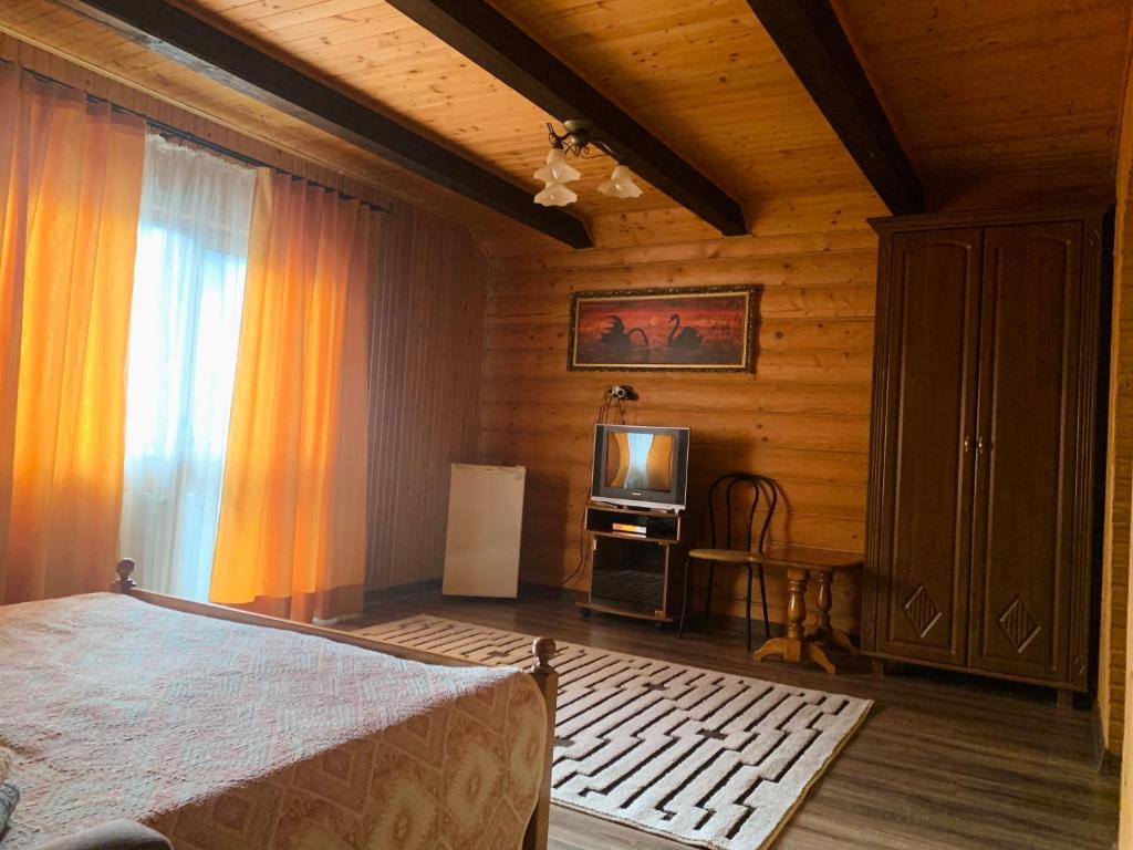 Postel nebo postele na pokoji v ubytování Бойківчанка