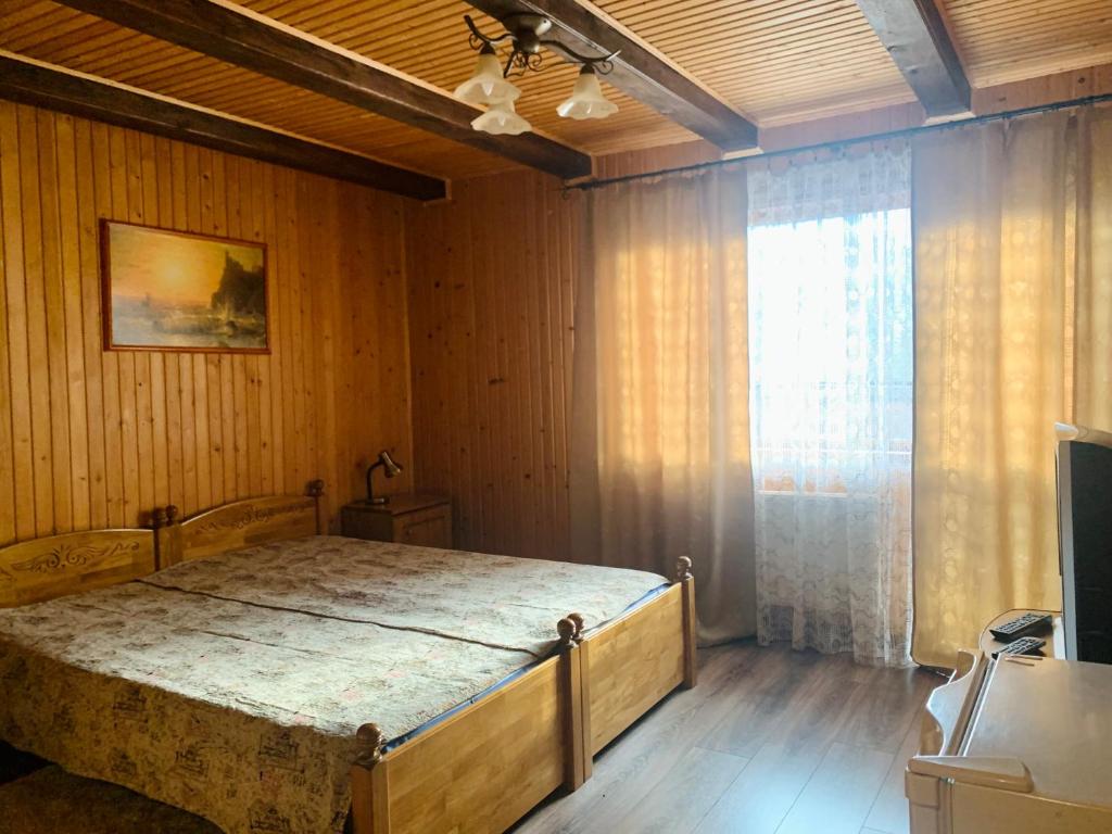 Postel nebo postele na pokoji v ubytování Бойківчанка