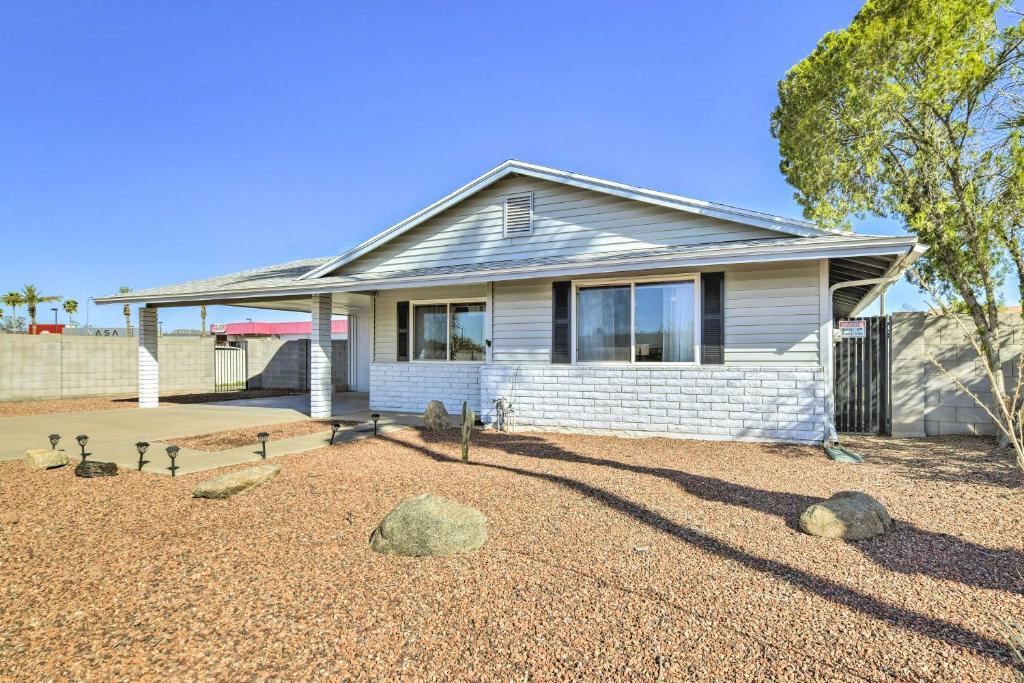 a house with a gravel yard in front of it at Family-Friendly Chandler Home Near Downtown! in Chandler