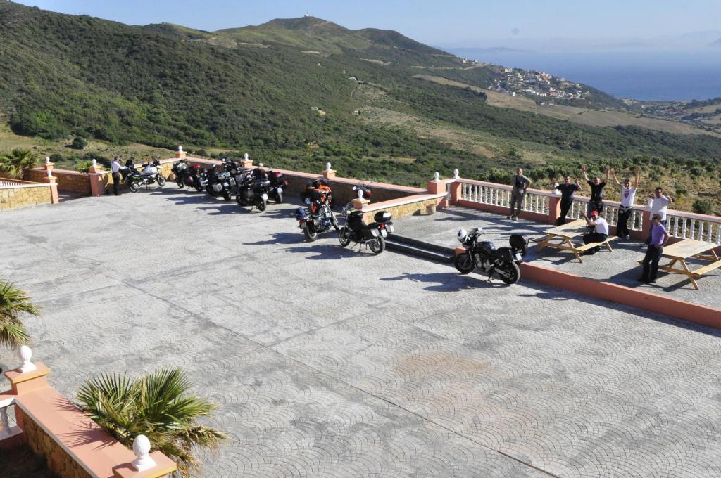 a group of people riding motorcycles on a balcony at Coopérative Village Jbel Moussa du Tourisme in Rcham