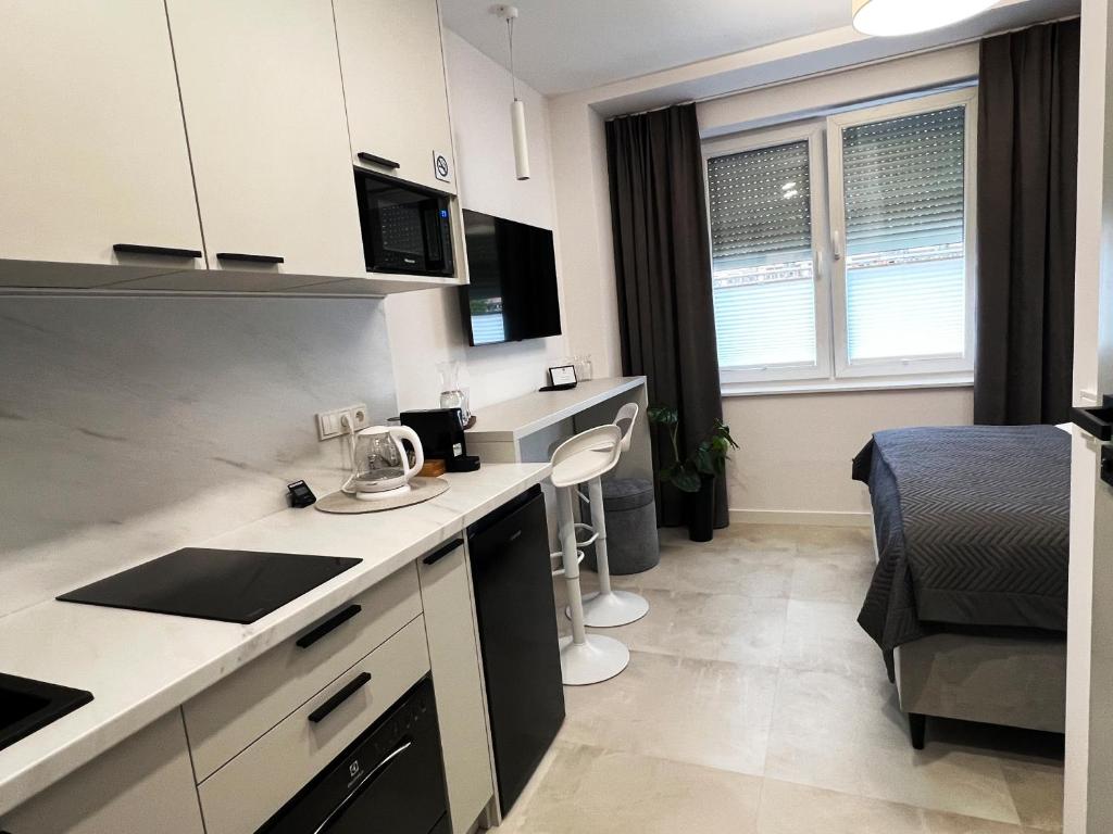 Kuchyň nebo kuchyňský kout v ubytování K20 Apartamenty Łódź - Dostęp na Kod