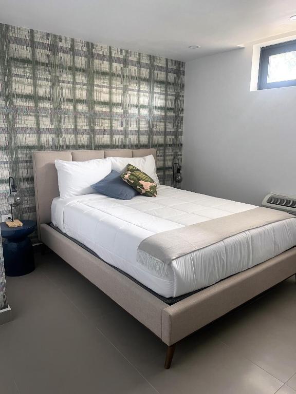 Postel nebo postele na pokoji v ubytování La Calma Poshtel