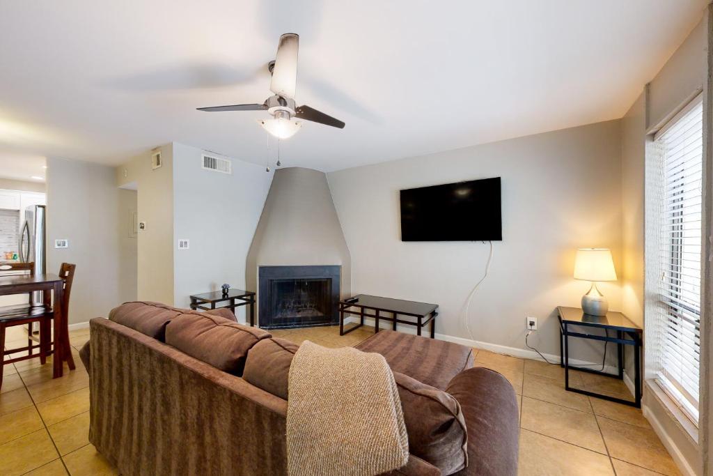 a living room with a couch and a fireplace at Golden Oasis, Unit #110 in Scottsdale