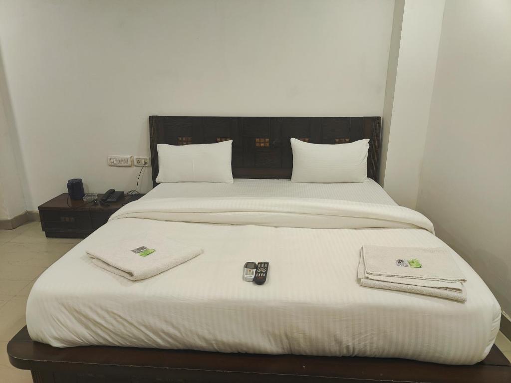 Postel nebo postele na pokoji v ubytování Hotel Apple Villa - New Delhi