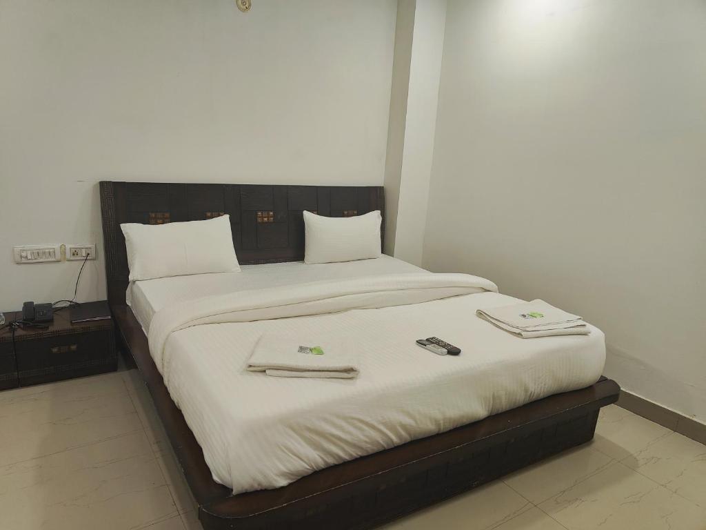 Postel nebo postele na pokoji v ubytování Hotel Apple Villa - New Delhi
