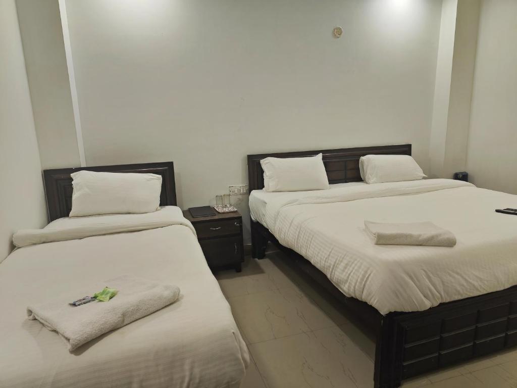 Postel nebo postele na pokoji v ubytování Hotel Apple Villa - New Delhi
