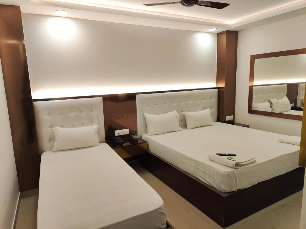 Postel nebo postele na pokoji v ubytování Hotel Apple Villa - New Delhi