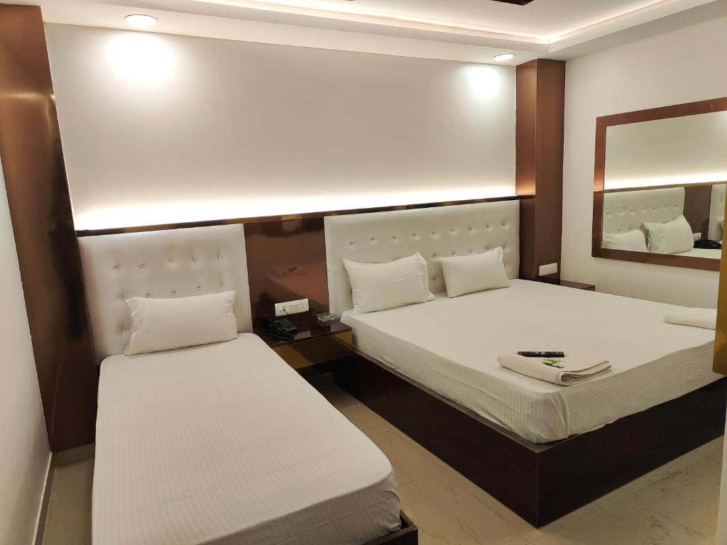 Postel nebo postele na pokoji v ubytování Hotel Apple Villa - New Delhi