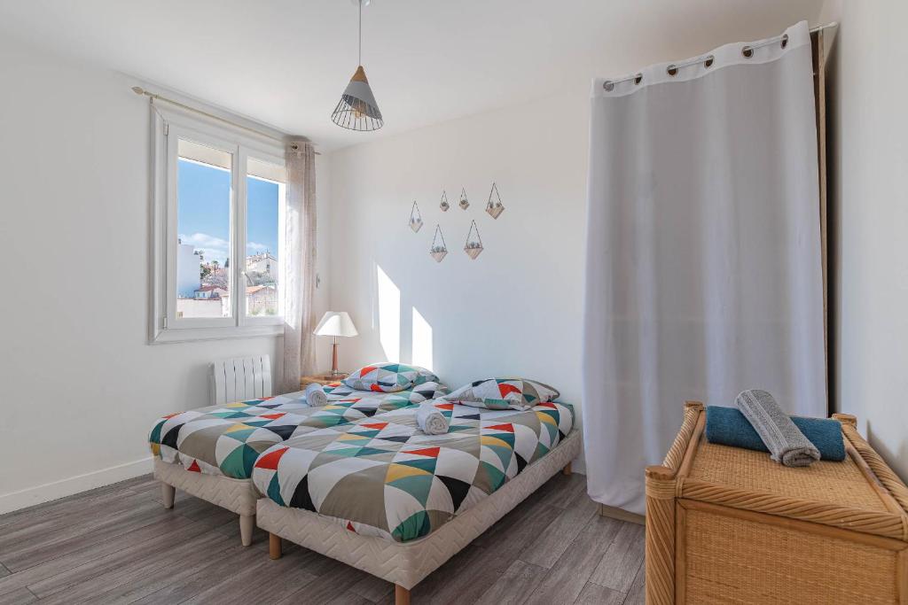 Posteľ alebo postele v izbe v ubytovaní Appt lumineux et spacieux au cœur de Cannes
