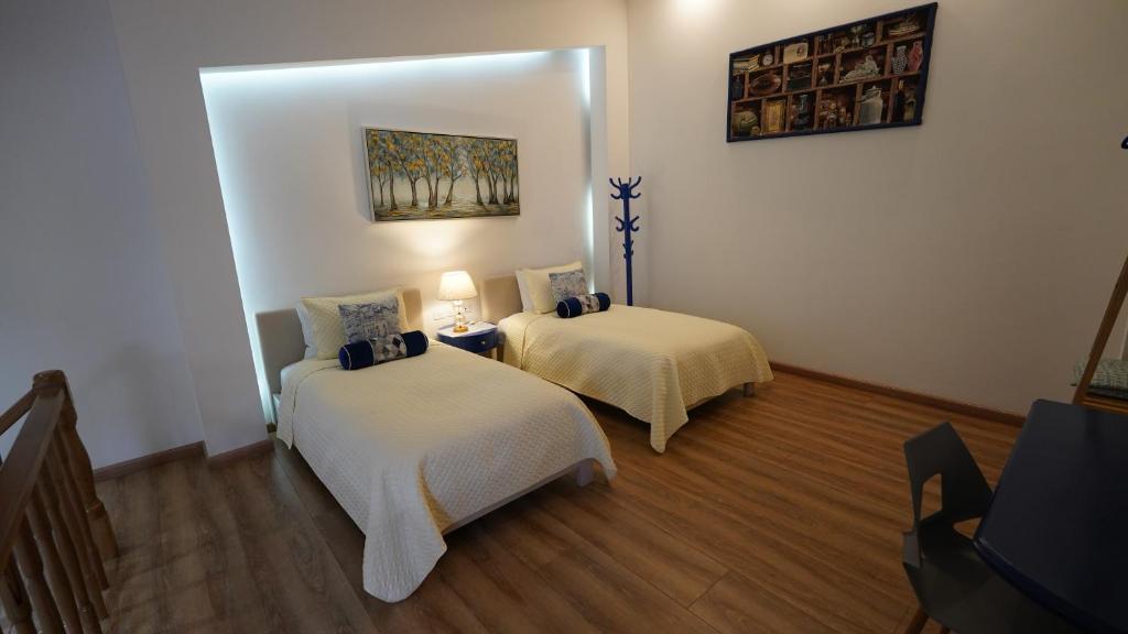 Postel nebo postele na pokoji v ubytování Adamas House Hotel Boutique