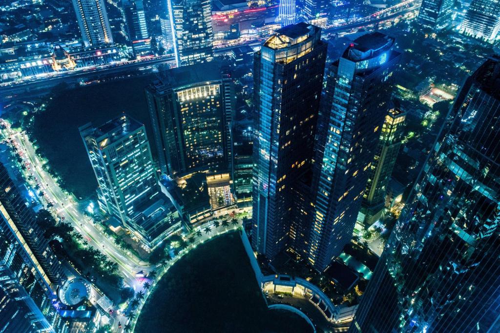 an aerial view of a city at night at The Ritz-Carlton Jakarta, Mega Kuningan in Jakarta