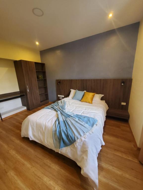 Postel nebo postele na pokoji v ubytování Hotel Inti Quito