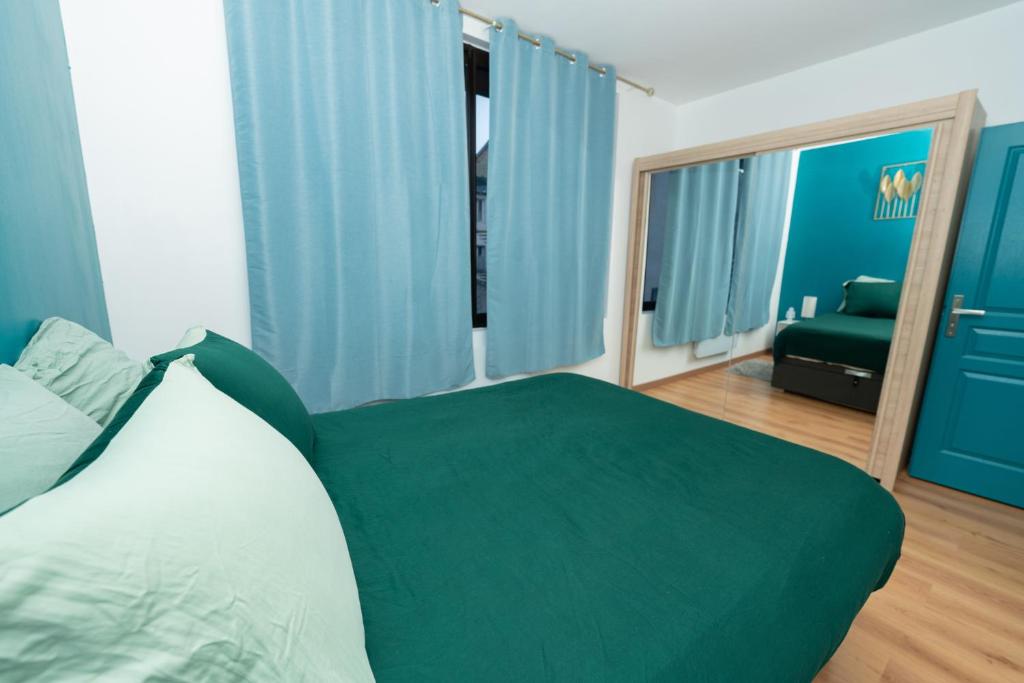 Postel nebo postele na pokoji v ubytování Le Paradis Bleu