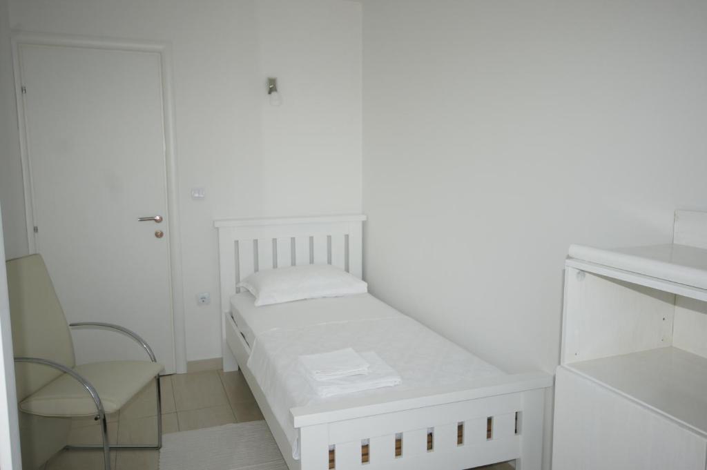 Posteľ alebo postele v izbe v ubytovaní Apartments Villa Rosina