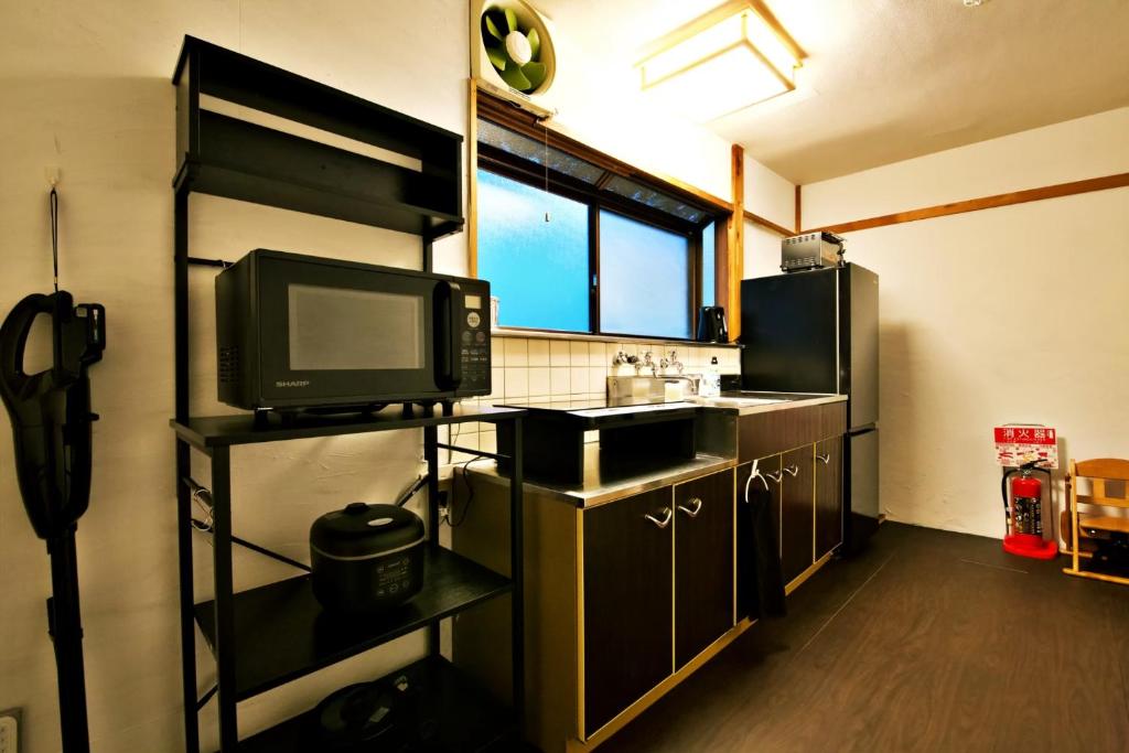 Kuchyň nebo kuchyňský kout v ubytování push house 伊東