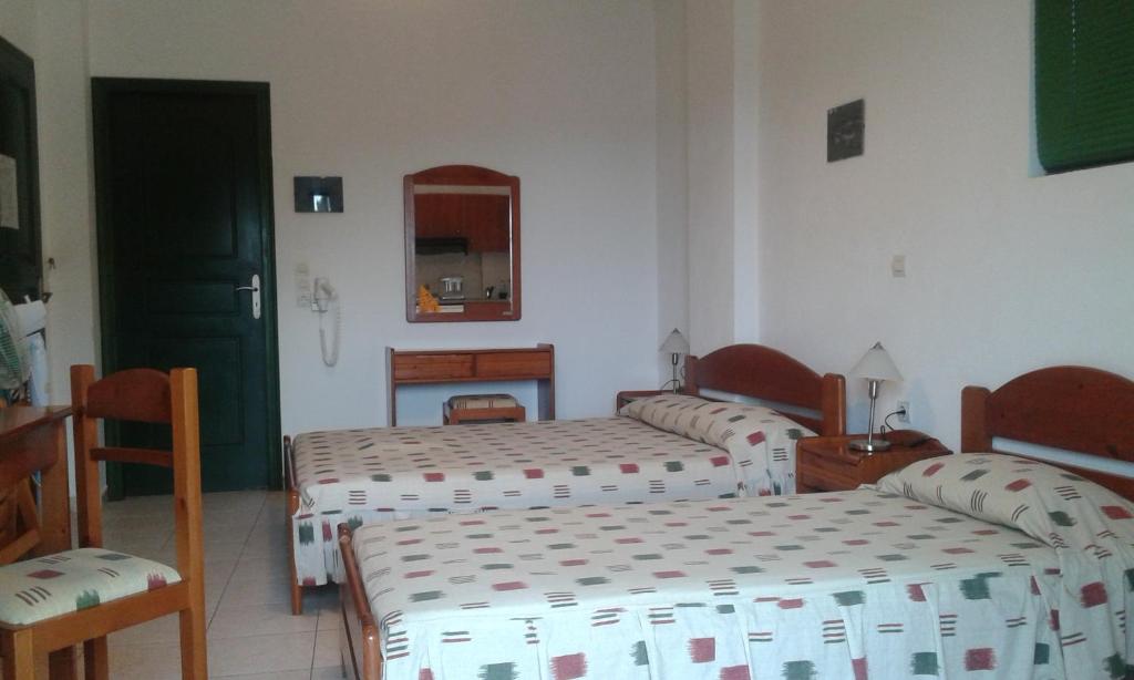 Łóżko lub łóżka w pokoju w obiekcie Evon's Rooms