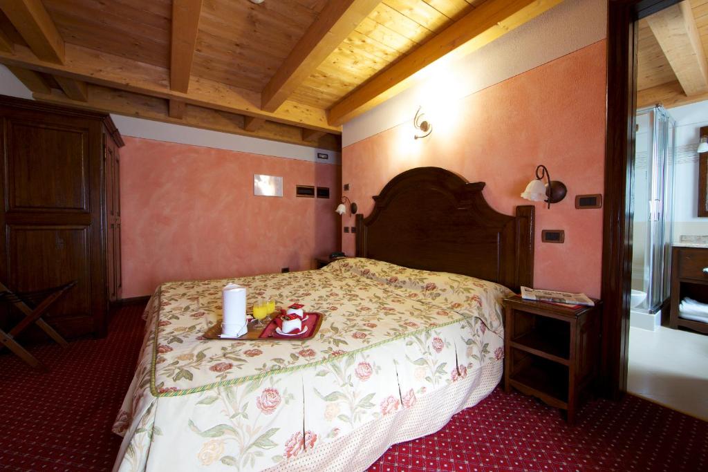 Postel nebo postele na pokoji v ubytování Hotel L' Aiglon