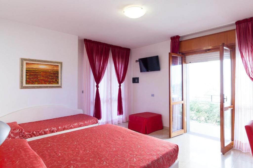 Postel nebo postele na pokoji v ubytování Hotel Palos