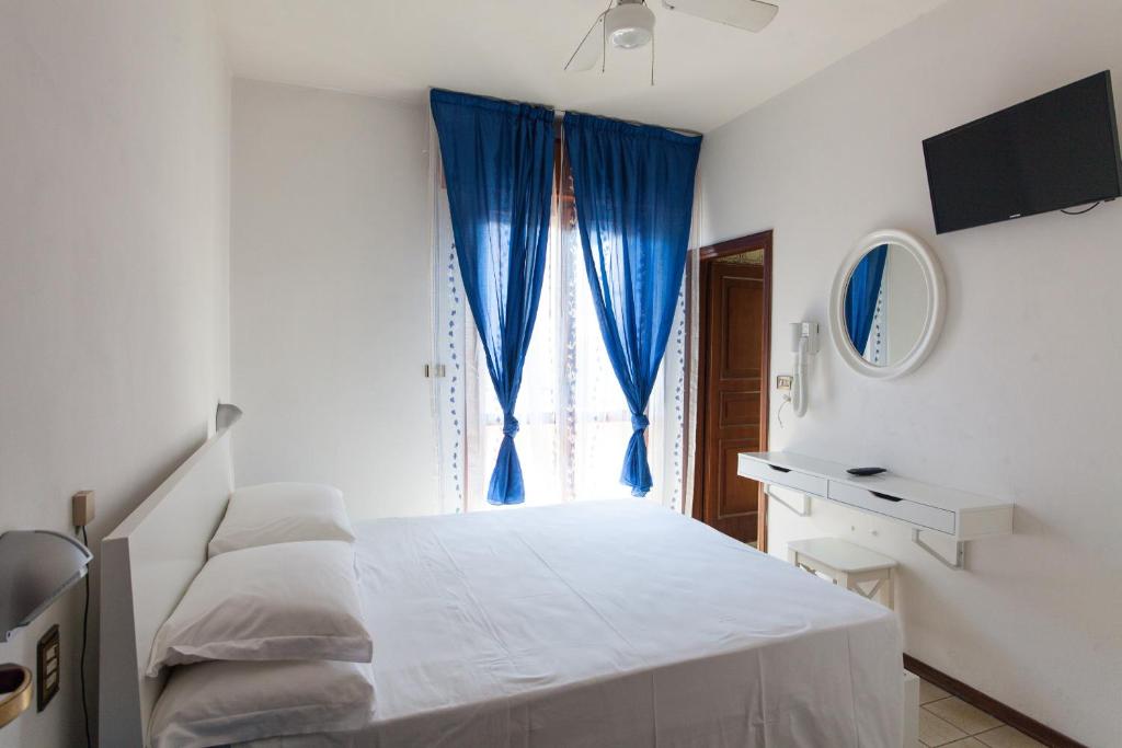 Postel nebo postele na pokoji v ubytování Hotel Palos