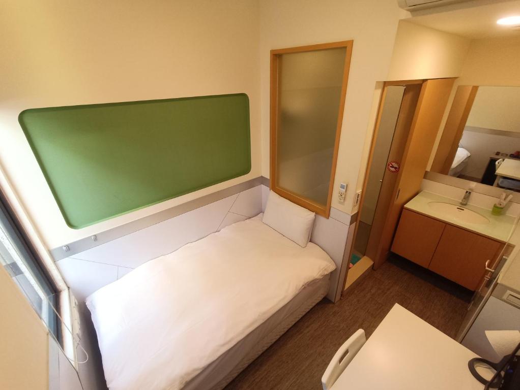 Postel nebo postele na pokoji v ubytování ColorMix Hotel & Hostel