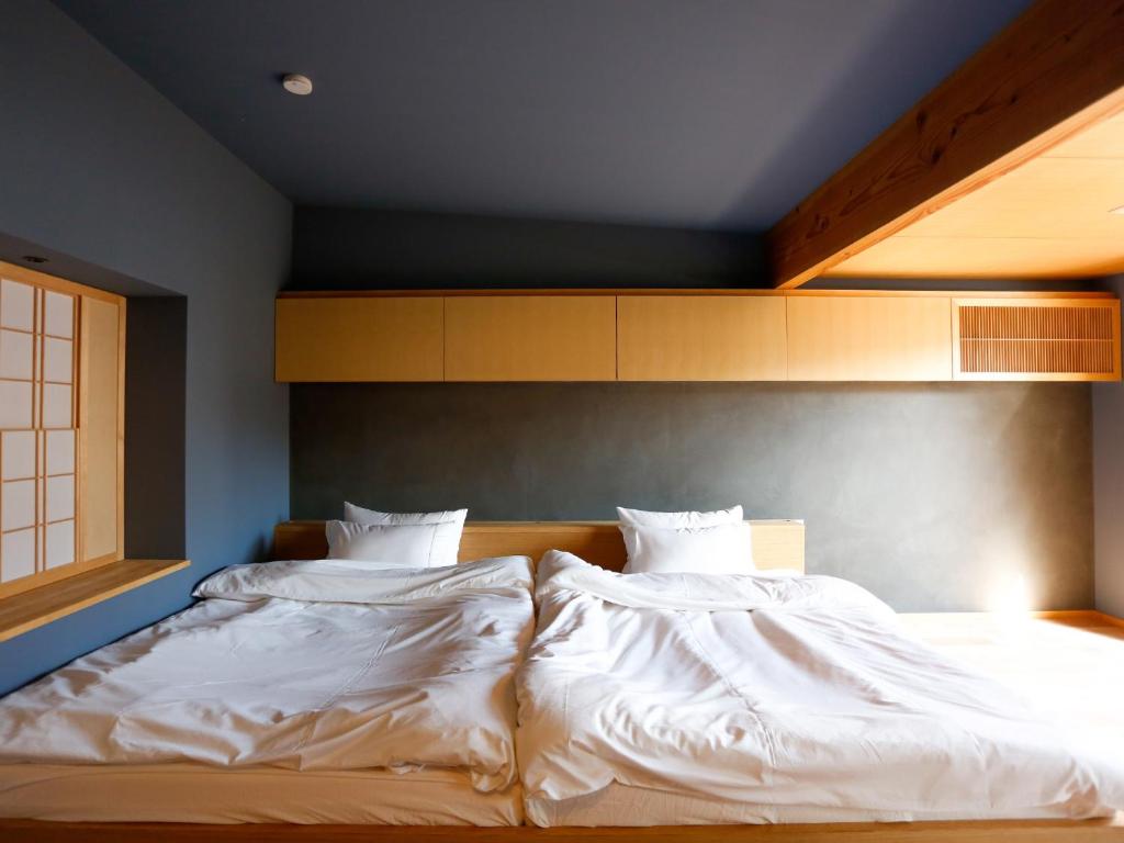 En eller flere senge i et værelse på Temari Inn Madoromi