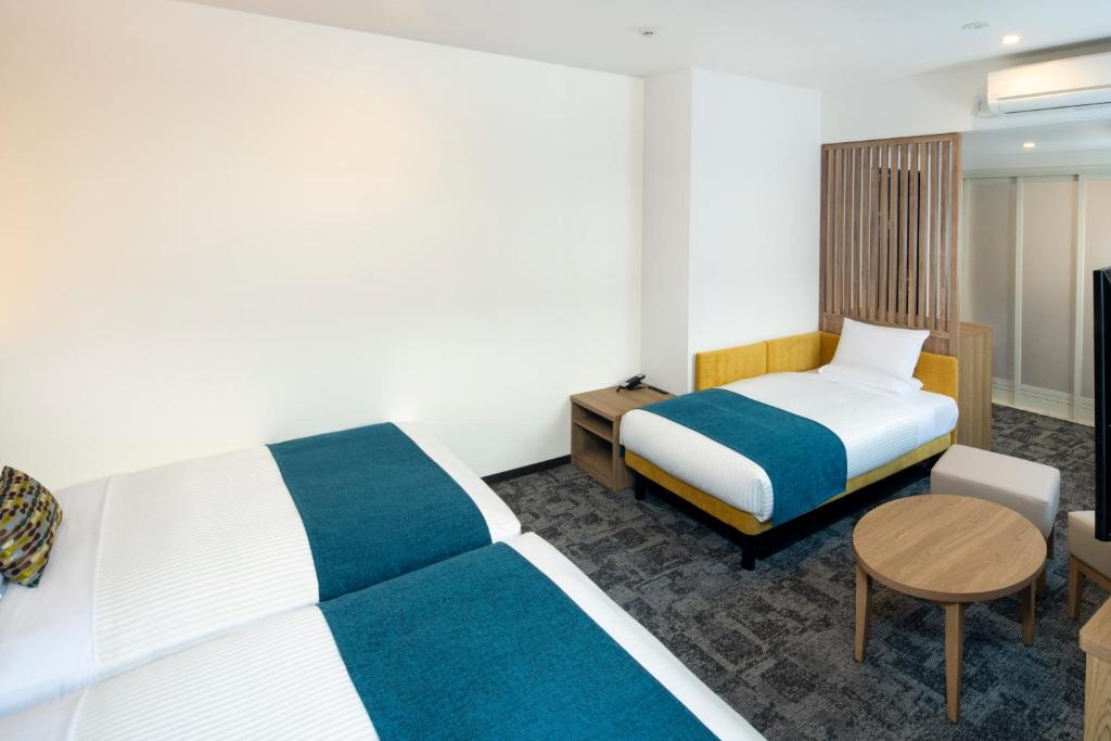 Postel nebo postele na pokoji v ubytování FLEXSTAY INN Shinurayasu