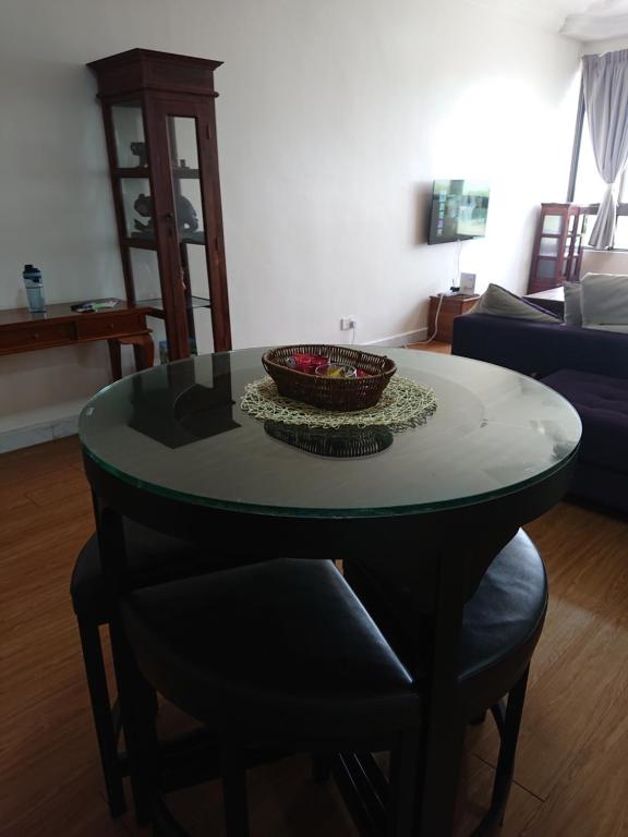 a table with a bowl on it in a living room at Butterworth Seaside view Family spacious in Butterworth
