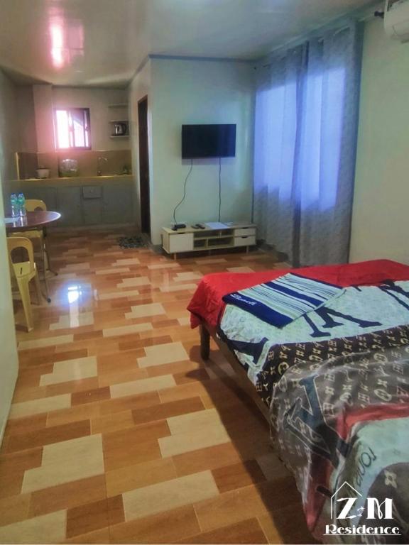 Postel nebo postele na pokoji v ubytování ZM Residence