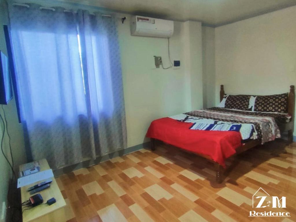 Postel nebo postele na pokoji v ubytování ZM Residence