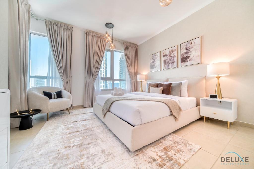 Postel nebo postele na pokoji v ubytování Glamorous 1BR at Residences 5 Downtown Dubai by Deluxe Holiday Homes