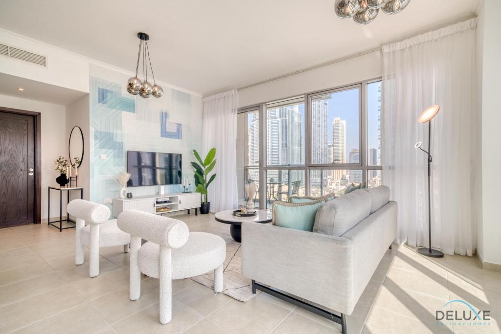 Posezení v ubytování Glamorous 1BR at Residences 5 Downtown Dubai by Deluxe Holiday Homes