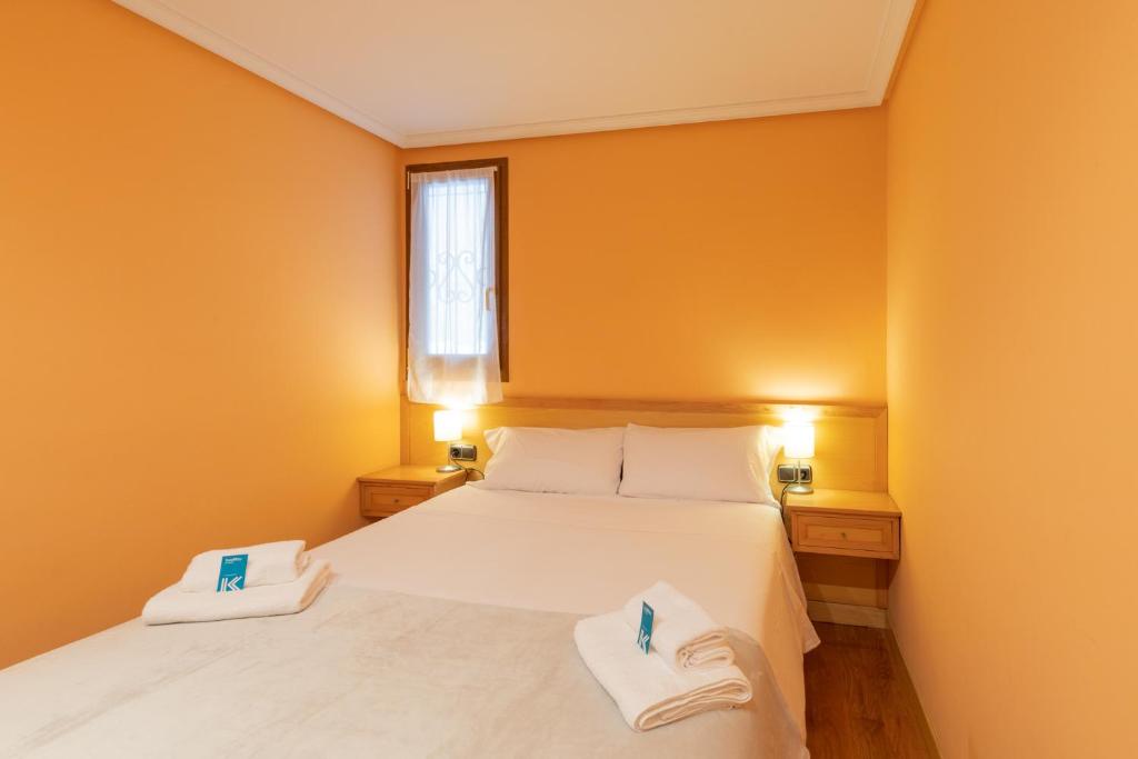 Postel nebo postele na pokoji v ubytování Saturraran - baskeyrentals