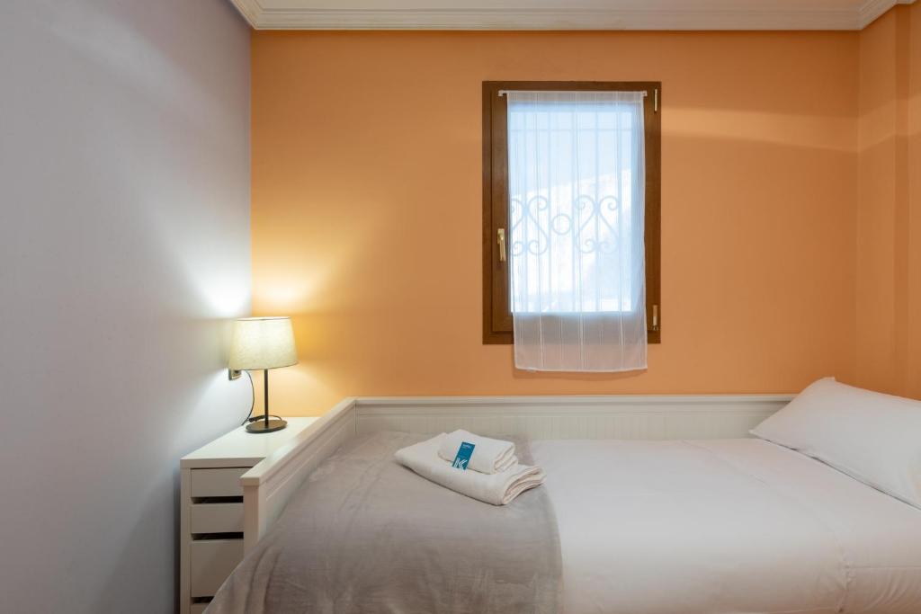 Postel nebo postele na pokoji v ubytování Saturraran - baskeyrentals