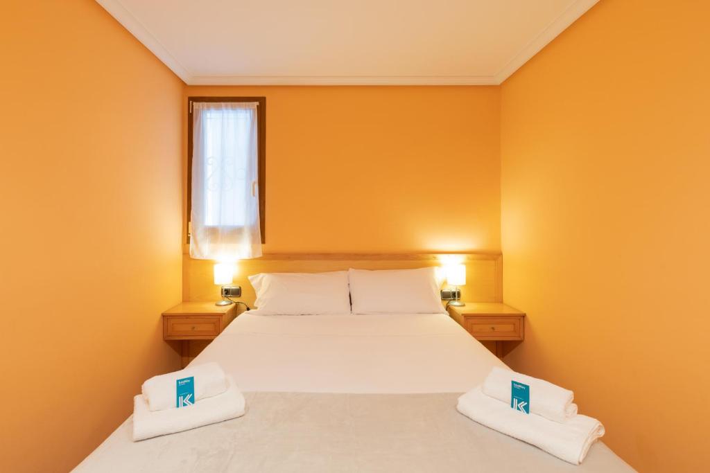 Postel nebo postele na pokoji v ubytování Saturraran - baskeyrentals