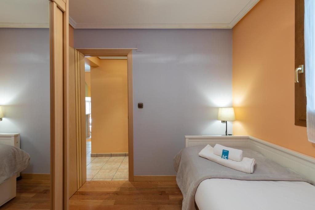 Postel nebo postele na pokoji v ubytování Saturraran - baskeyrentals