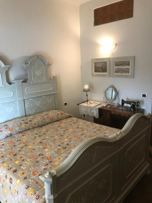 Un pat sau paturi într-o cameră la B&B La Sciguetta