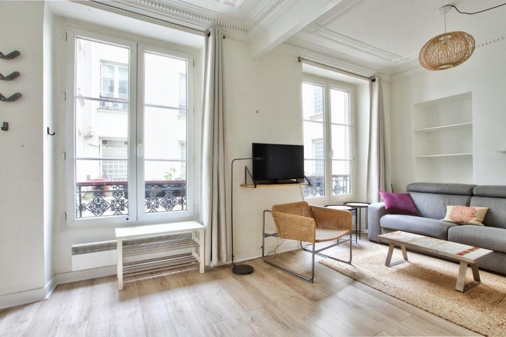 Televízia a/alebo spoločenská miestnosť v ubytovaní Appartement Quartier Hotel de Ville Free Netflix