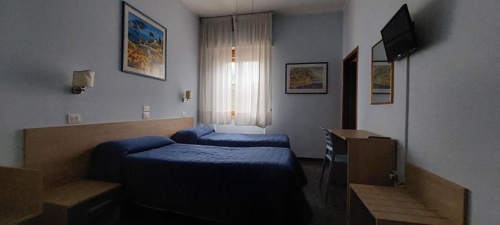 Postel nebo postele na pokoji v ubytování Hotel Lea