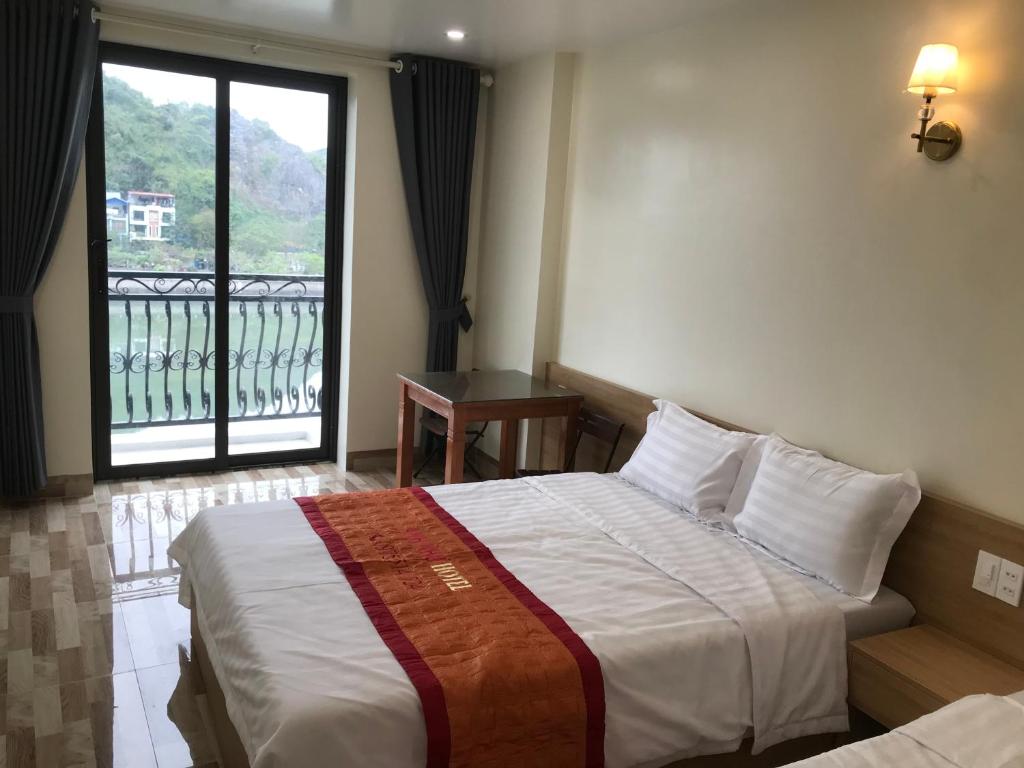 Postel nebo postele na pokoji v ubytování Anh Nhu Hotel