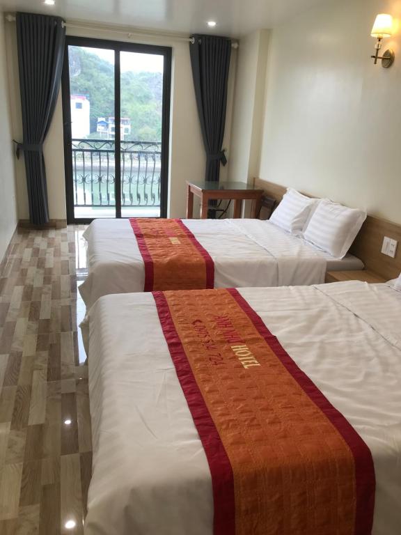 Postel nebo postele na pokoji v ubytování Anh Nhu Hotel