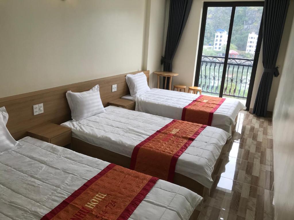 Postel nebo postele na pokoji v ubytování Anh Nhu Hotel