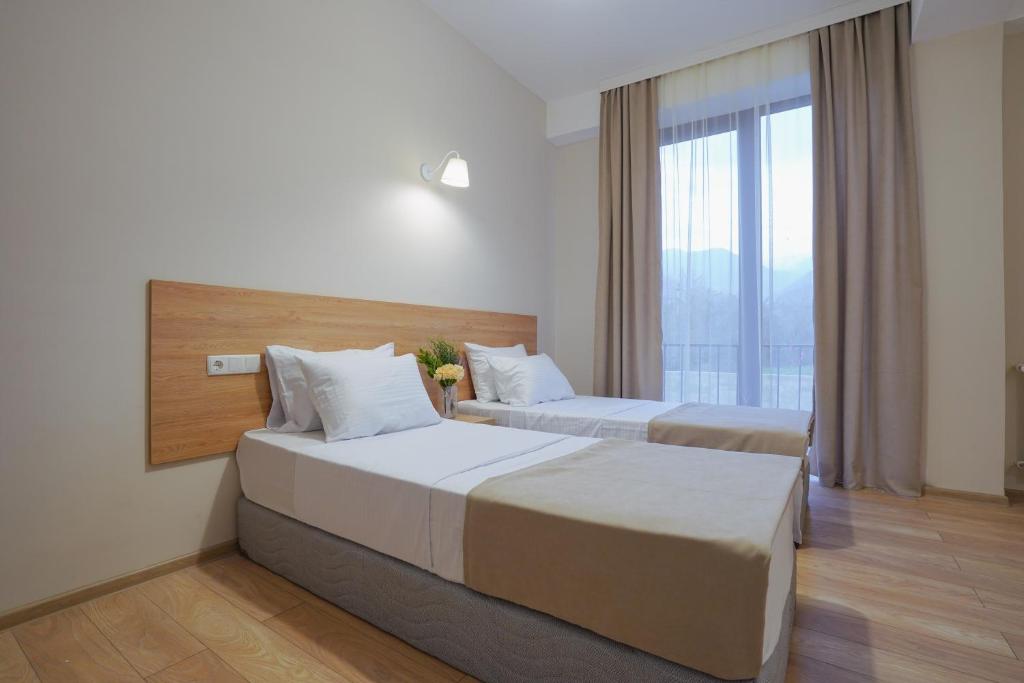 Postel nebo postele na pokoji v ubytování Tilia Kvareli Resort