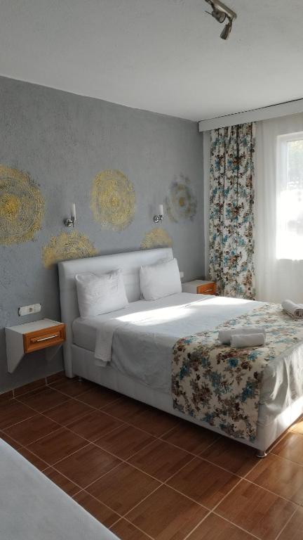 Postel nebo postele na pokoji v ubytování Cemils Guest House