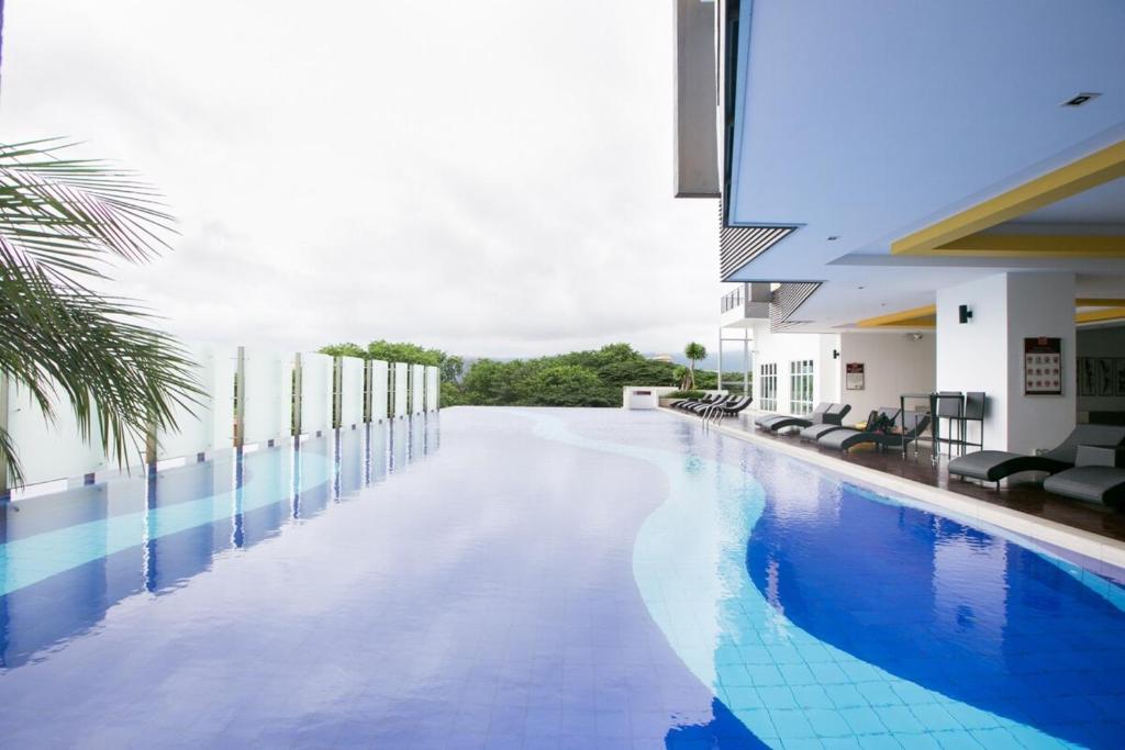 a swimming pool in the middle of a building at The Majestic Ipoh in Ipoh