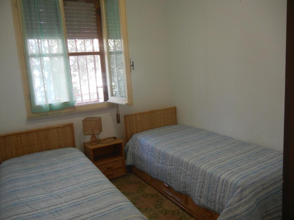 Katil atau katil-katil dalam bilik di CASA VACANZE MARE