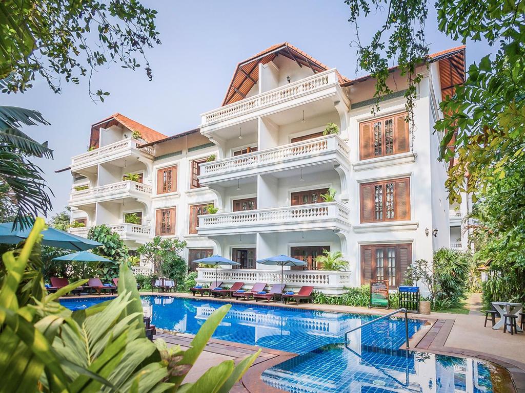 an image of a hotel with a swimming pool at Chateau d'Angkor La Residence in Siem Reap