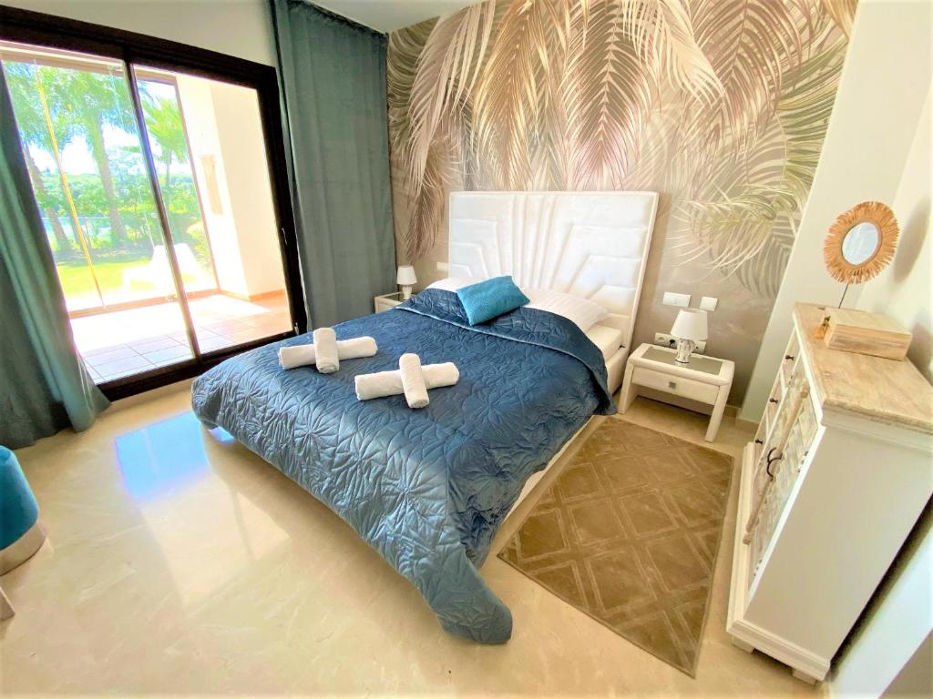 Posteľ alebo postele v izbe v ubytovaní Breathtaking apartment, Paradise Palm View Marbella