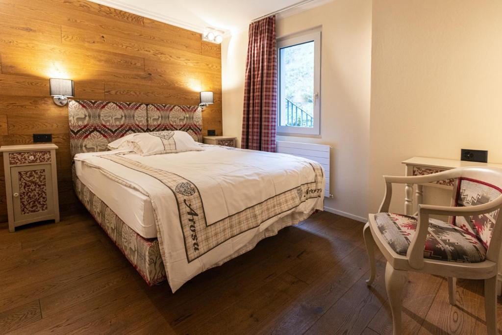 Postel nebo postele na pokoji v ubytování Home Hotel Arosa