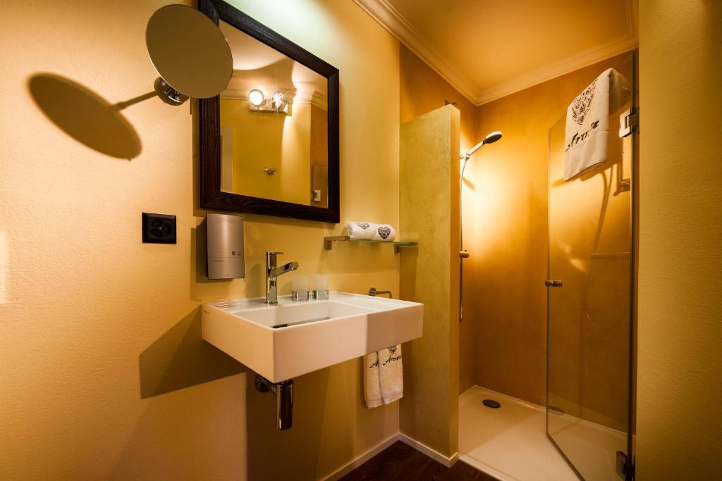 Koupelna v ubytování Home Hotel Arosa